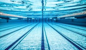 An underwater view of a commercial swimming pool